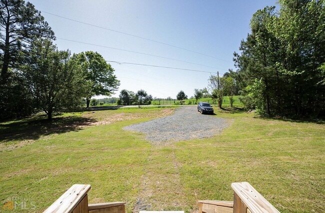 Photo - Spacious 4-Bedroom Home with Lawn Maintena...