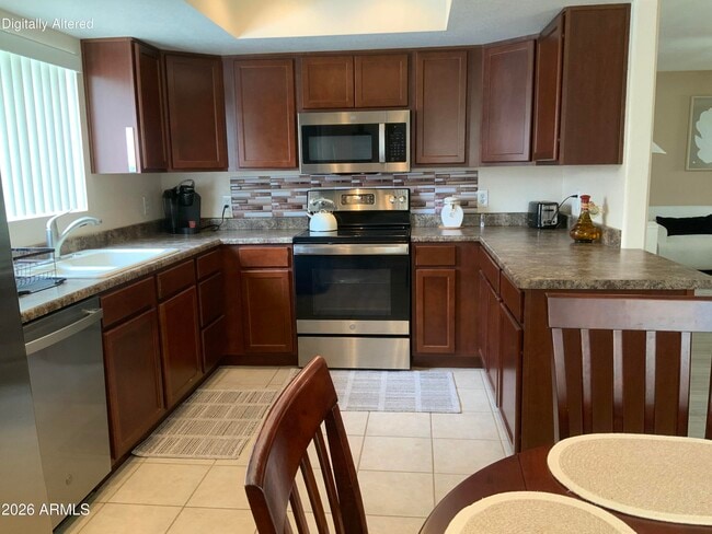 Building Photo - 9745 N 95th St Unit 130