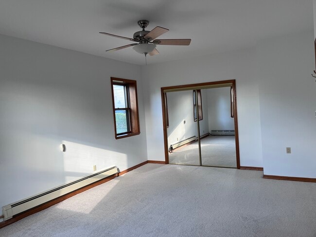 bedroom 1 on floor level with carpet and large closet space - 239 Kingston Ave Unit apartment on 2 floors