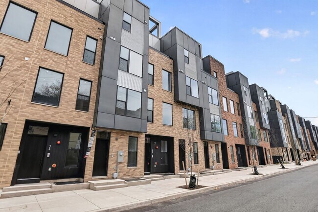 Photo - Garage parking, private outdoor space, and skyline views—this Northern Liberties home checks ever...