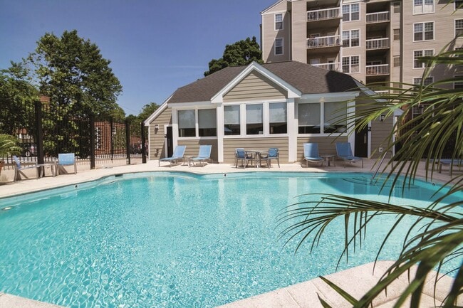 Sparkling Pool & Sundeck with Relaxing Lounge Chairs - Rosslyn Heights Apartments