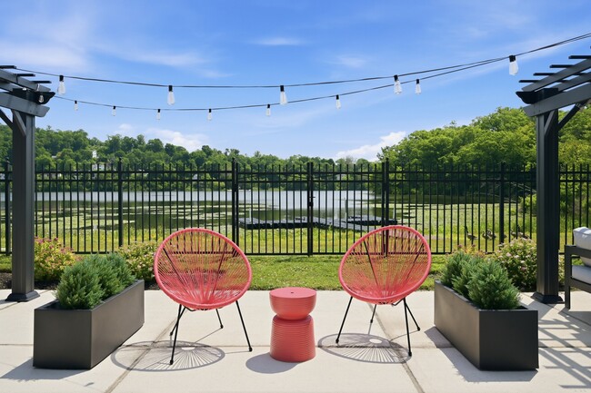 Unwind in style at Eagle Rock Apartments at Mohegan Lake. Enjoy serene views and cozy seating on your private patio, perfect for relaxation. Embrace the lakeside lifestyle—schedule your visit today!