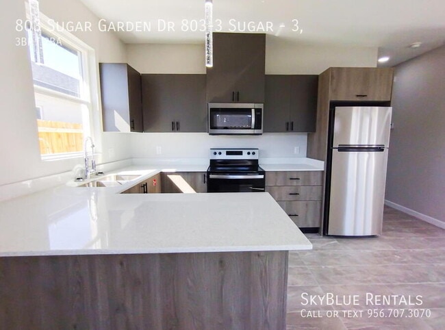 Building Photo - 803 Sugar Gdn Dr Unit 3,