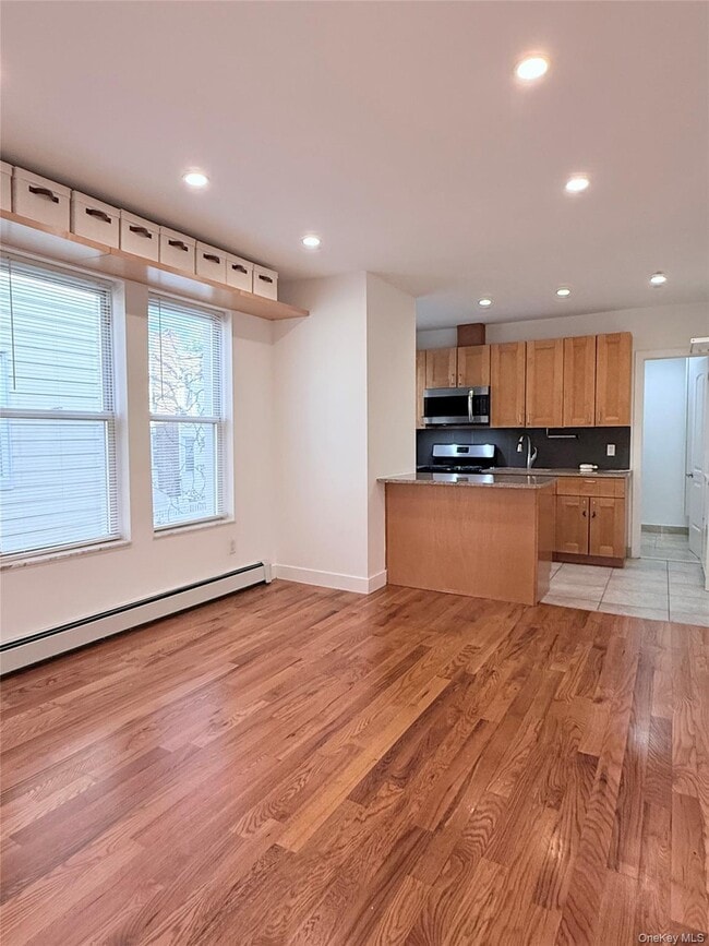 Building Photo - 60-08 Cooper Ave Unit 2