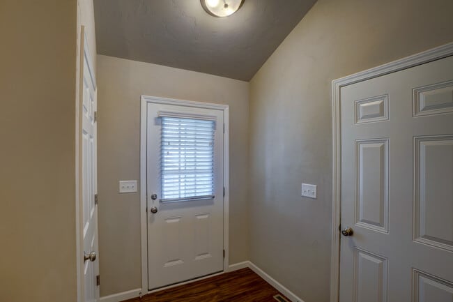 Foyer, door to right is garage - 826 Thompson Dr