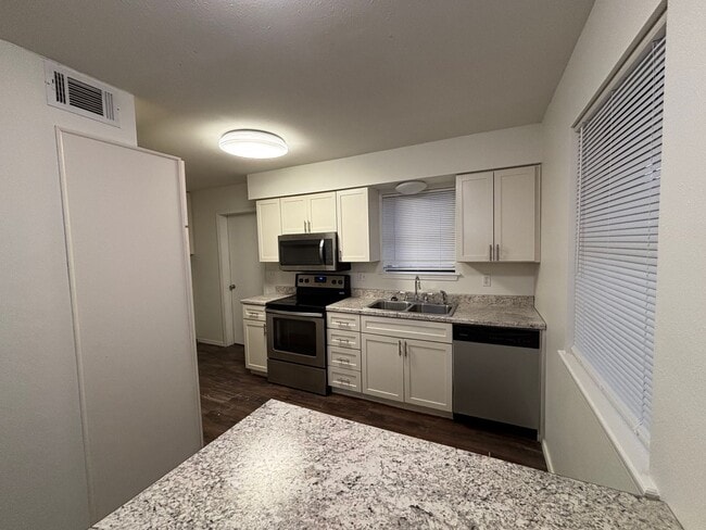 Photo - Welcome to this charming 3-bedroom, 2-bathroom home located in the heart of Russellville, AR.