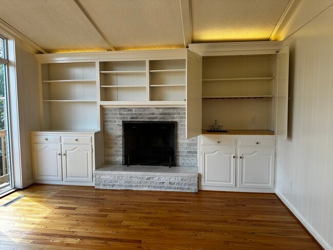 Wet Bar and surrounding bookshelves and cabinets - 3030 Hardale Blvd Unit 2 Upper