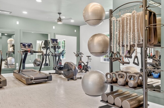 Brand-new resident fitness center at Saddlebrook Apartments featuring modern cardio and strength training equipment. - Saddlebrook Apartments