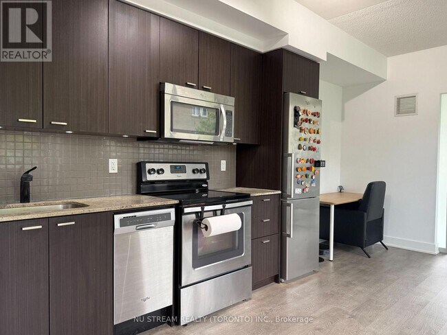 Photo - 88 Sheppard Ave E Unit 211