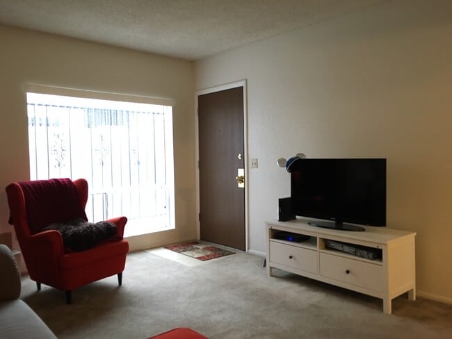 Living room with example furnishings (not provided) - 702 E Linden St