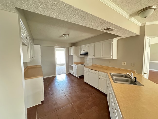 Photo - Grand 4BR/2BA Near Southwind | 2,438 Sq Ft, Stone Fireplace, Soaking Tub & 2-Car Garage