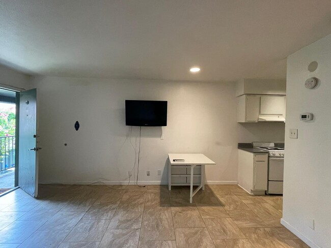 TV and foldable table - 100 Lorenz Rd Condo Unit 506