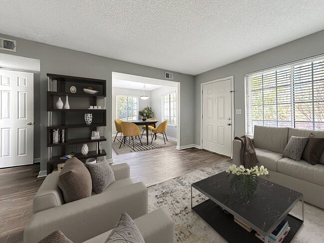 Spacious Living Area With Hardwood-Style Flooring