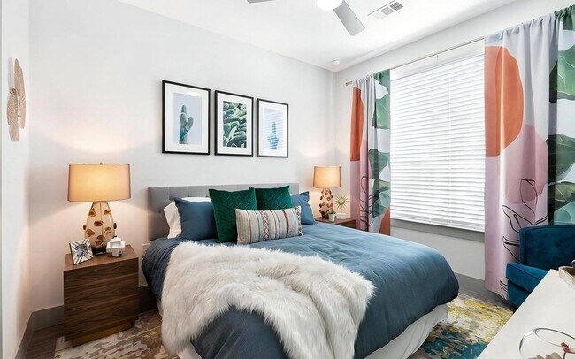 Natural light fills this bedroom, with floor space for more than the bed.