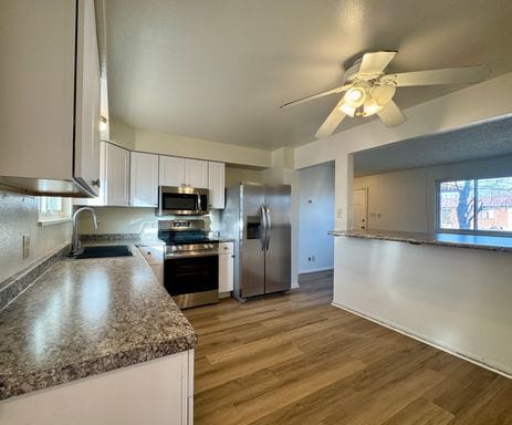 Photo - Spacious 5-Bedroom Single-Family Home with Fenced Yard & Garage