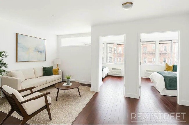 Photo - 2 Bed Home with large Living Space – Laundry, Roof Decks, Pet Friendly Unit 4A