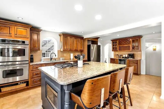 Photo - Stunning 3BR 3BA Fully Furnished Home w/ Granite Kitchen + Patio & Fenced Yard in Prairie Village