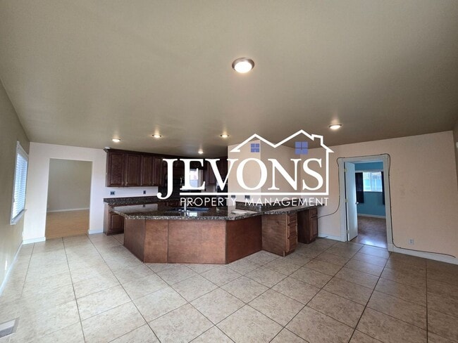 Photo - Move-in Special: $500 off your first month’s rent. Cozy 4-bedroom home with a fully equipped kitc...