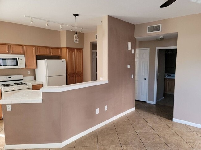 Photo - 2 story condo with 1 bedroom loft, 2 bathrooms and a 1 car attached garage.