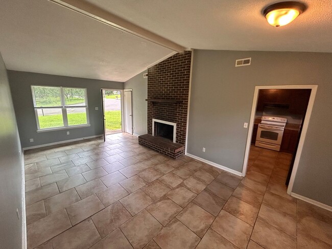 Photo - 3br 1BA house with decorative mantle and garage with move in special for July!