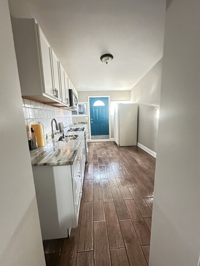 Photo - Spacious 4BR Rowhome Near Ellwood Park, Washer/Dryer Included