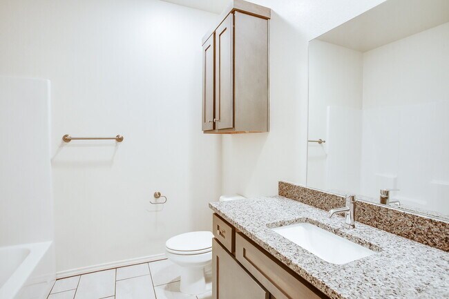 Photo - "Charming 2-Bed Oasis with Granite Eleganc...