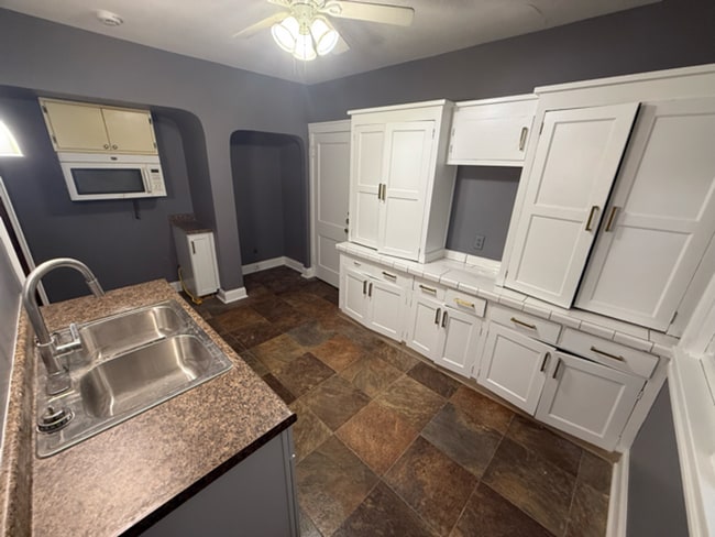 Photo - ? Updated 4BR/2BA Single-Family Home — Garage Parking, Water & Lawn Care Included ?