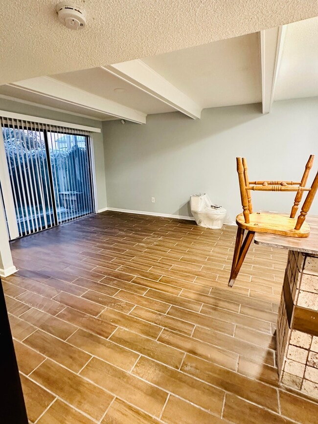 Kitchen and dining leads to sliding doors patio - 3637 Haughton Ln Unit 1