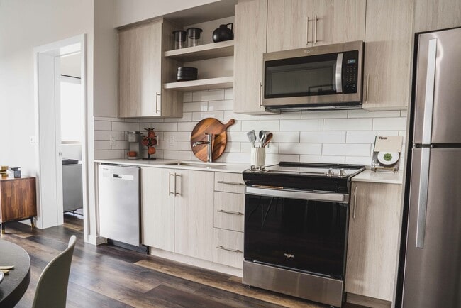 The kitchen features sleek stainless steel appliances.