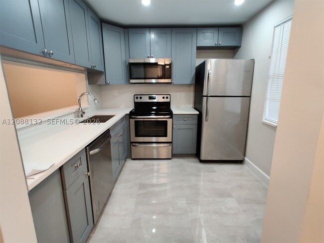 Building Photo - 8750 Royal Palm Blvd Unit 220-3