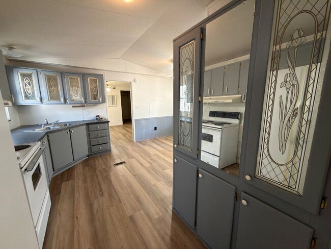 Photo - 3 bed 2 bath. New vinyl floors throughout. Unit A