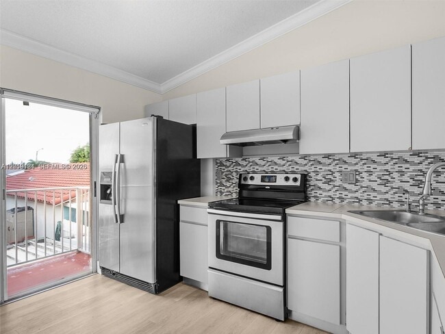 Building Photo - 3375 W 76th St Unit 211