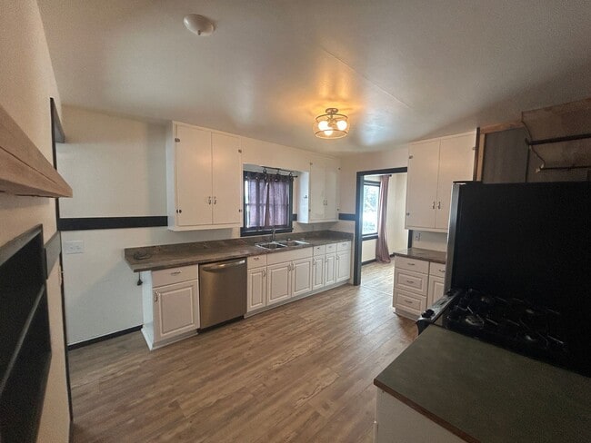 Photo - Bigfork Rodeo Farmhouse~ Fenced garden, greenhouse, garage, barn and shop!