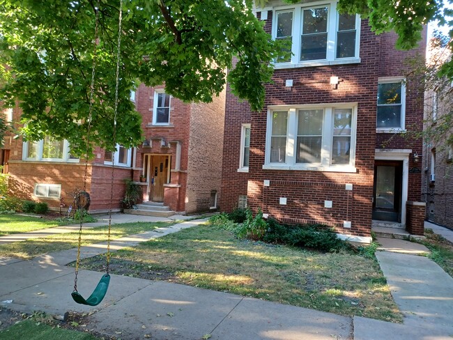 Building front w/swing - 2710 W Giddings St Apartments Unit 2