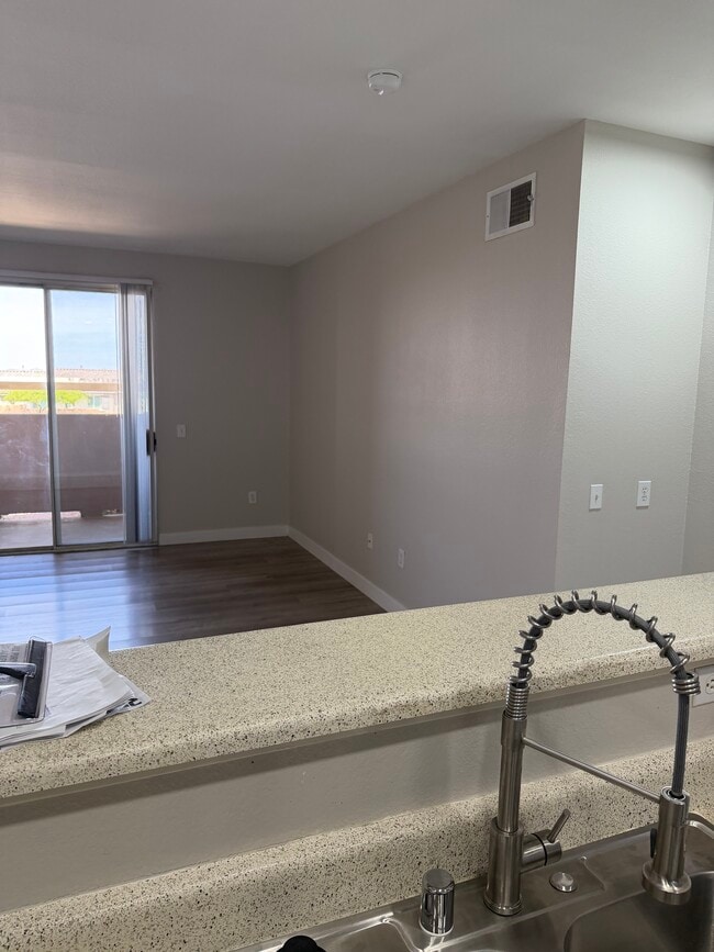 view of living room and sliding glass doors over patio - 231 W Horizon Ridge Pky Unit 2311