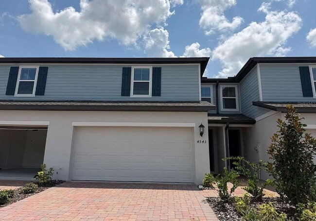Building Photo - "Spacious 3-Bedroom Townhouse with Granite Elegance in St. Cloud – 4543 Rangeland Way"