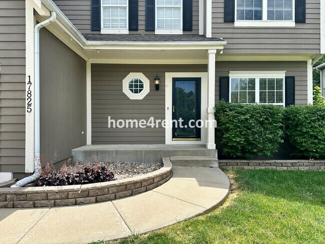 Photo - Beautiful Four-Bedroom Home with Three Car Garage, Wood Floors, Finished Basement and a Fenced Ya...