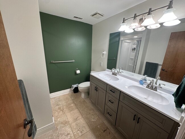 Shared bathroom with double vanity - 921 Ashley Cir