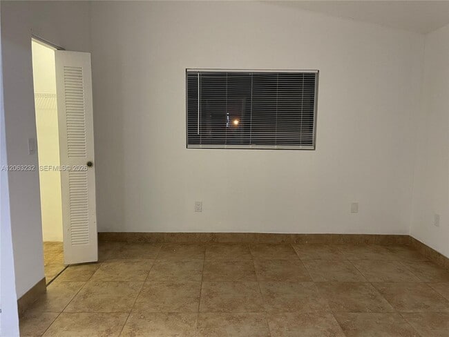 Photo - 9491 Palm Cir S Unit 203