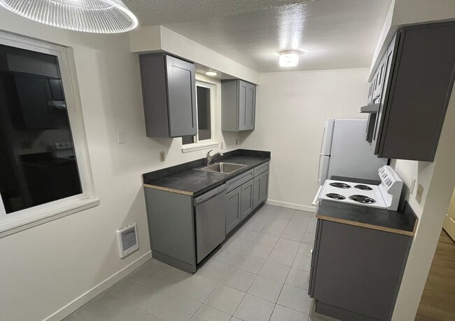 Newly remodeled kitchen with new cabinets and luxury sink. - 3333 Willow Ct SE Unit Fourplex - 3333