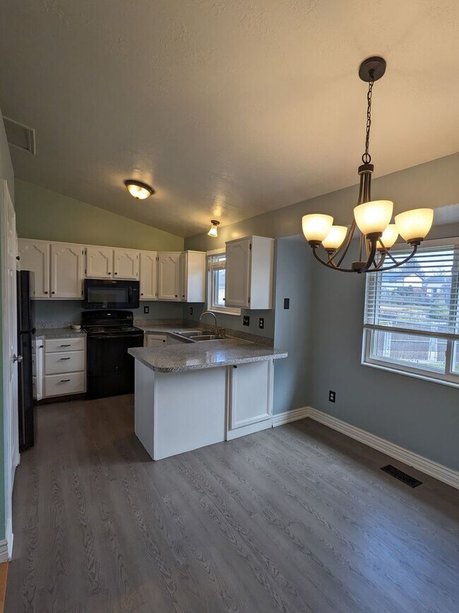 Photo - Spacious 5-Bed Clearfield Home with Garage & Fenced Yard