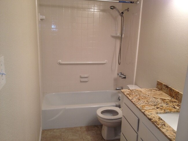 Photo - 3 Bed, 2 Bath. Hardwood floors, quartz countertops, stainless steel appliances.