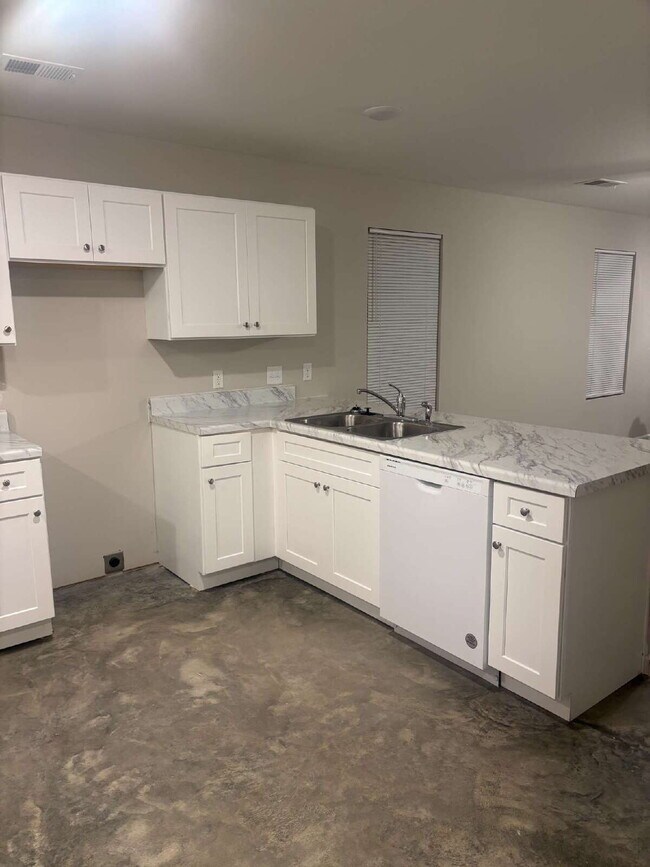 "Charming 4-Bedroom Retreat with 2 Full Baths on Sunny View Drive!"