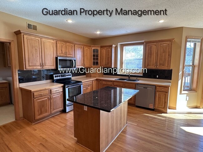 Building Photo - Brooklyn Park Single Family Home, Office, 3 Car Garage, New Carpet, Large Deck, Available Now