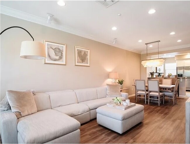 Open and well-lit floor plan with high ceilings - 5429 Strand Townhome