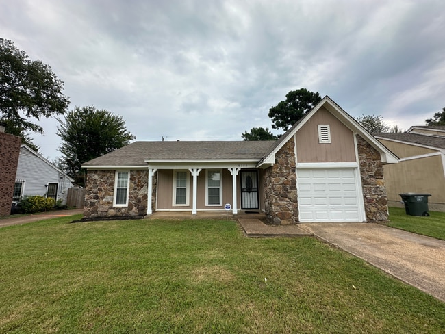 Building Photo - Charming 3BR/2BA Near Southwind | Soaring Vaulted Ceilings, Rustic Fireplace & Garage