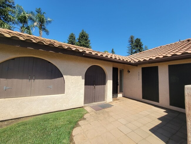Photo - Condo with open floor plan and a two-car g...
