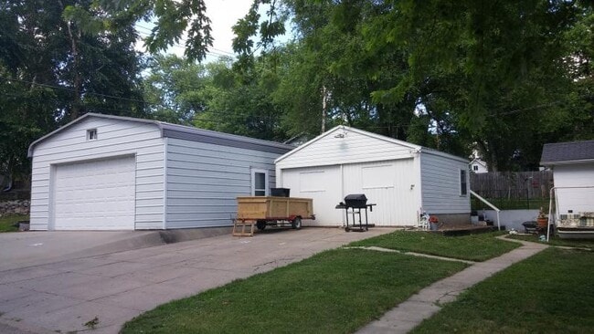 Small garage included with rental property. Larger garage is not.