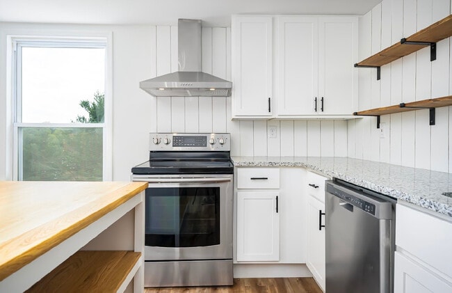 Kitchen w granite, stainless appliances and open shelving - 2922 Marston Rd House Unit #2