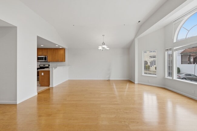Photo - Top-Floor 3BR in Duplex Near BART | Vaulted Ceilings | In-Unit Laundry | Garage Parking